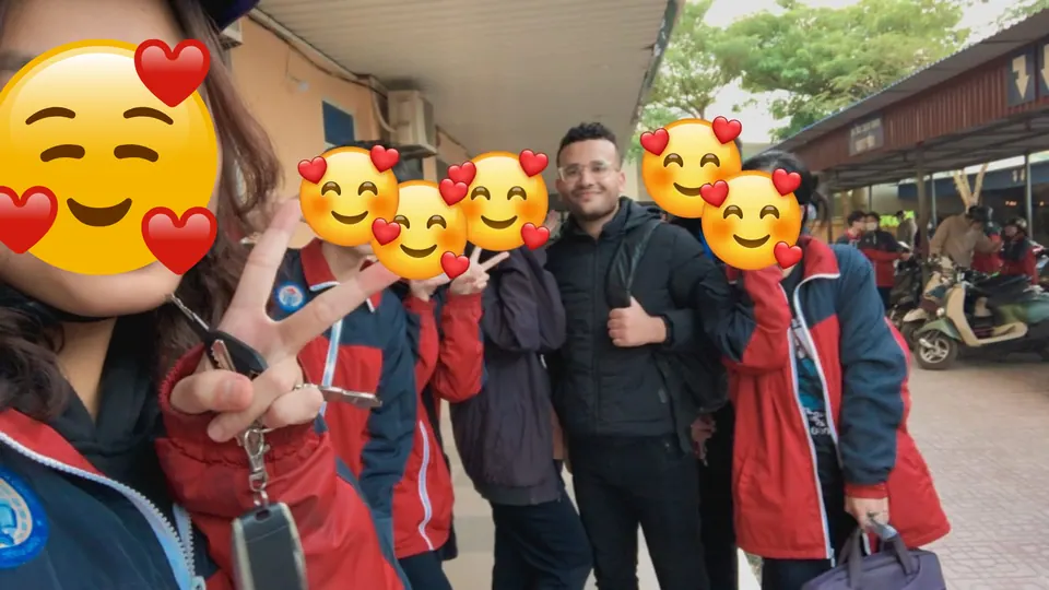 Mr. Nas with students outside a school